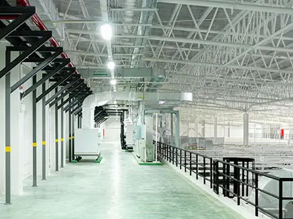Interior view of a large commercial building with HVAC and piping systems