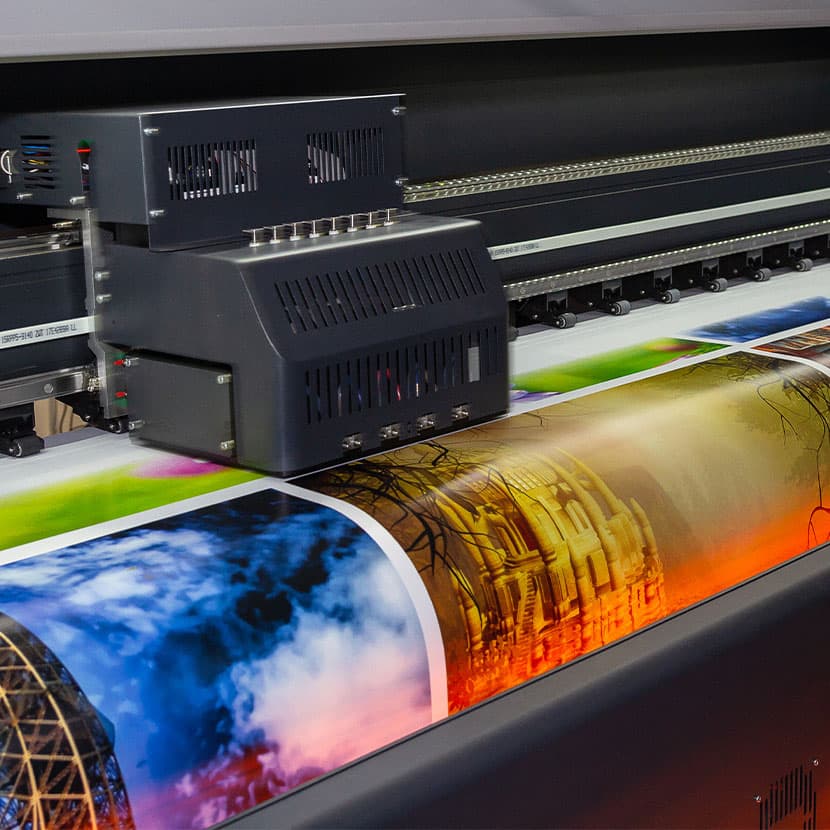 Large industrial printer producing colorful printed material for advanced printing systems