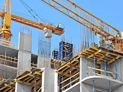 Construction site with cranes and structural framework for building infrastructure