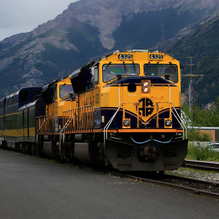 Yellow locomotives on railway tracks for rail system sensor applications