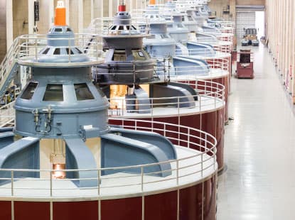 Interior view of clean energy facility with large machinery for renewable power generation