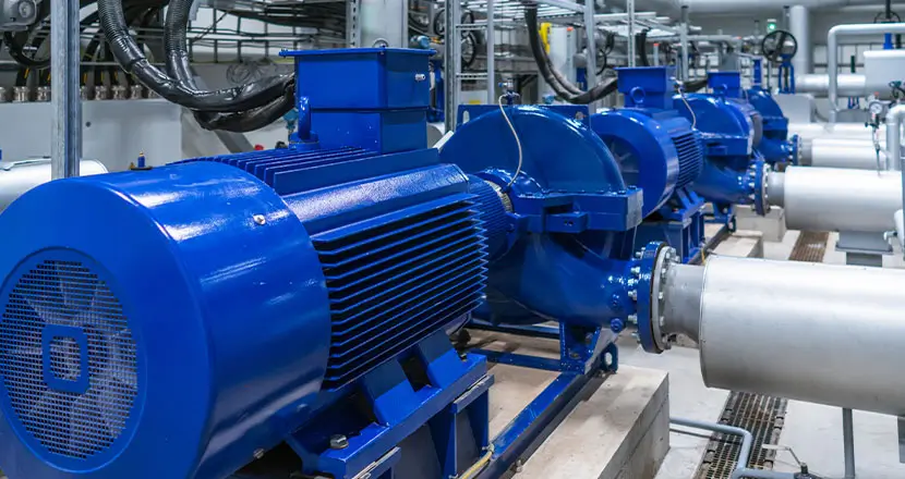 Industrial HVAC system with blue pumps and piping for heating and cooling applications