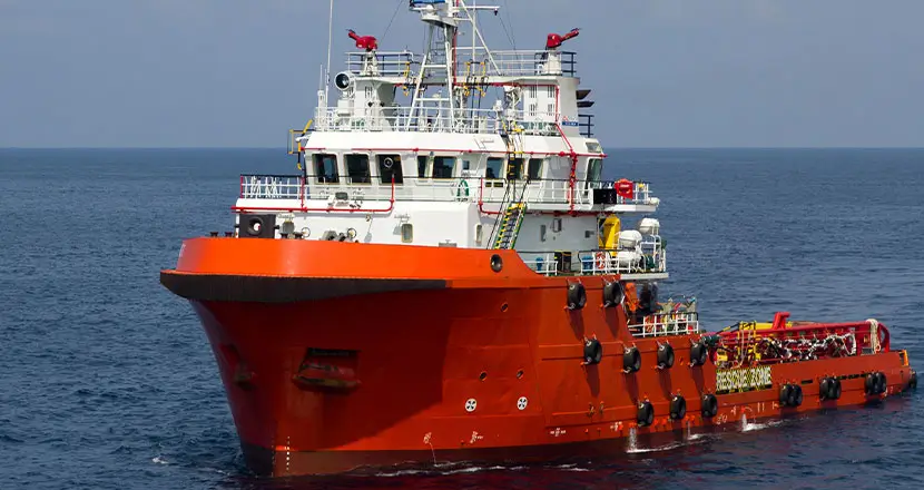 Red and white marine vessel on open water for rugged sensor applications