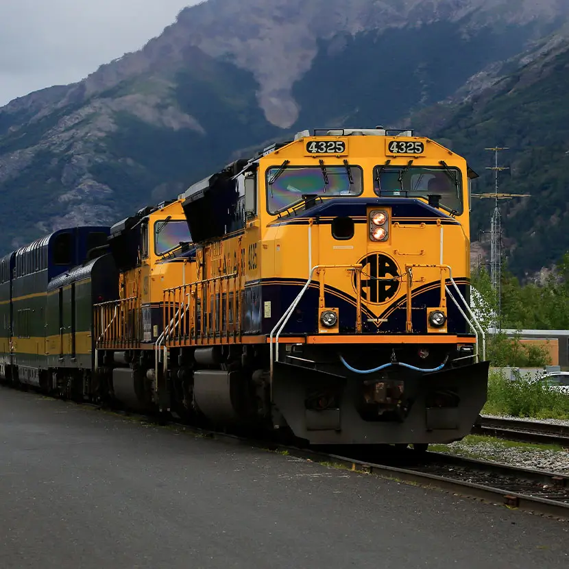 Yellow locomotives on railway tracks for rail system sensor applications