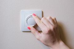 dimmer switch in your home.  Or from Bigstock’s web page: A woman's hand adjusts the lighting with a dimmer lever. An electronic device designed to change electrical power. Used to adjust the brightness of the light emitted by incandescent lamps or LEDs.}
