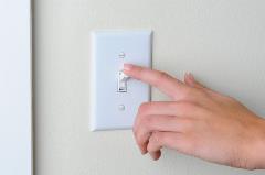 picture of a home light switch.  Or from Big Stock’s website:  Woman’s hand with finger on light switch, about to turn off the lights. Closeup of hand and switch only